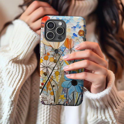 Woman holding a stained-glass wildflower MagSafe phone case