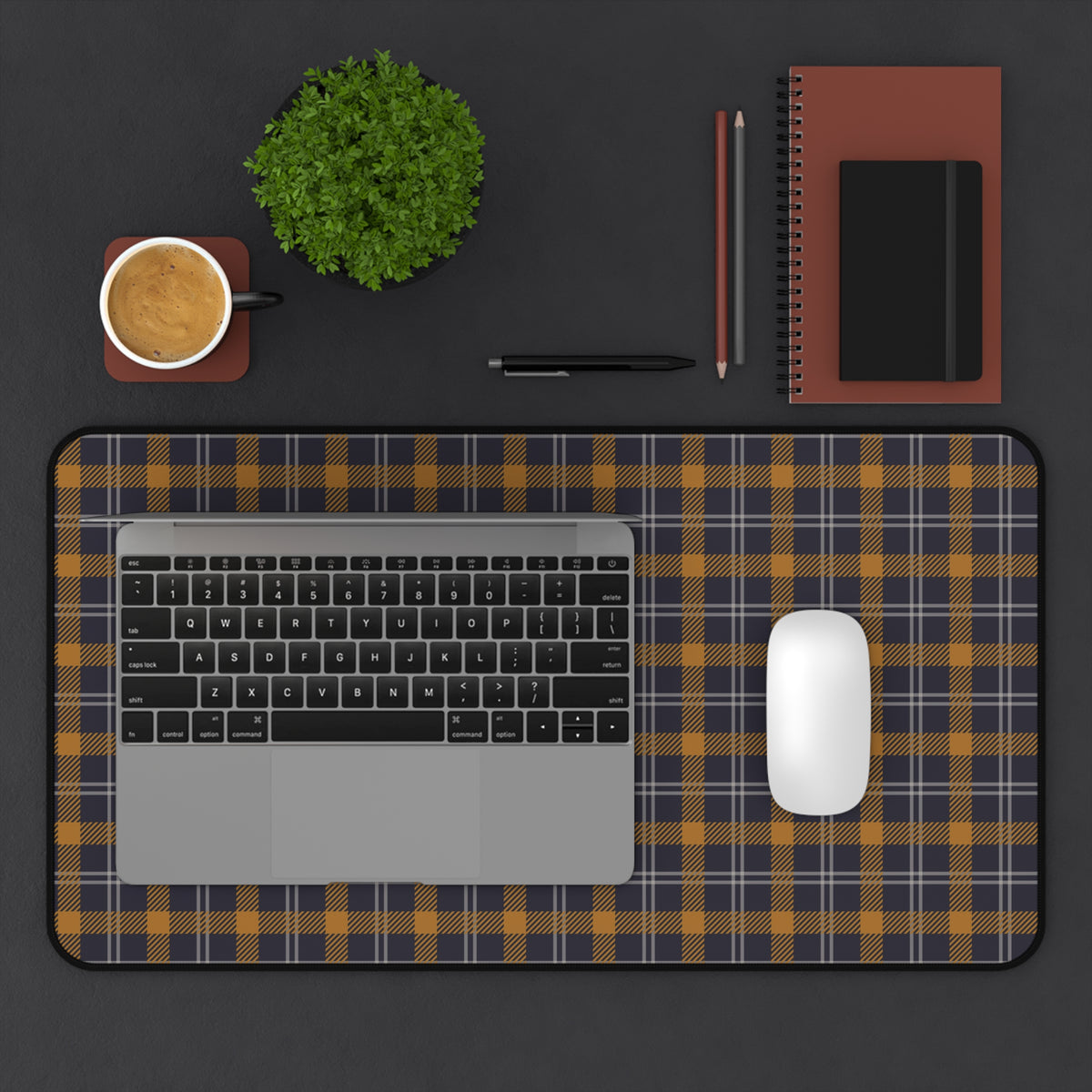 Laptop and mouse on the navy ochre plaid desk mat
