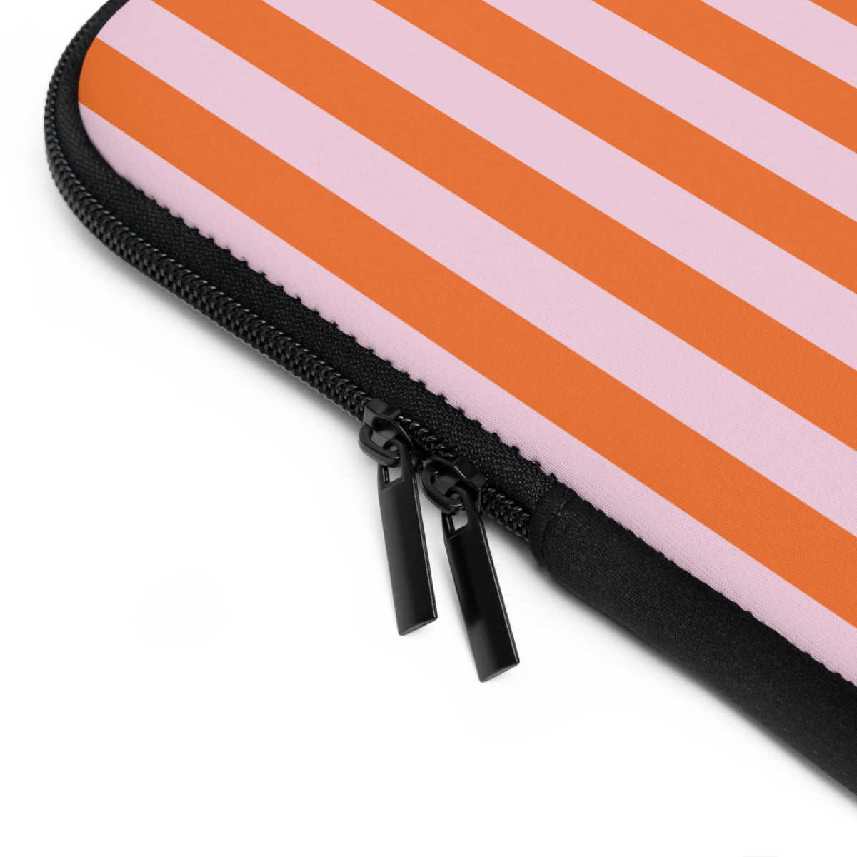 Close-up of the zipper and edge of the orange cabana stripe laptop sleeve