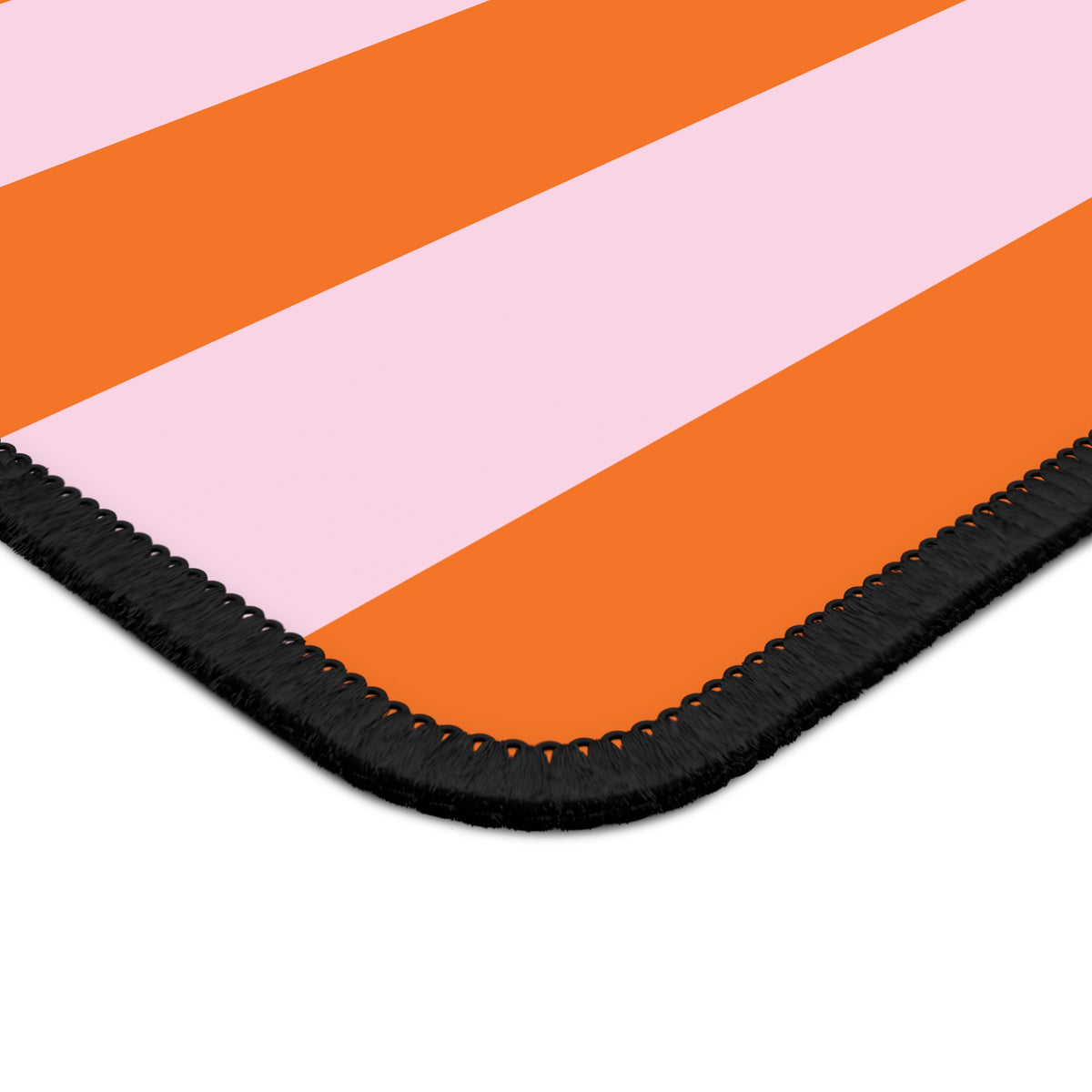 Close-up of the Orange Cabana Stripe mouse mat stripes and stitched edge