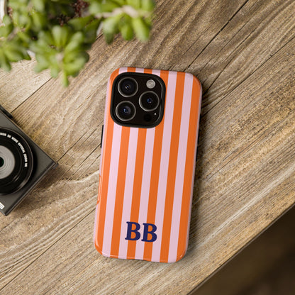 Orange Cabana Stripe tough phone case on a wooden table