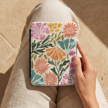 Painted Garden Kindle case held on a lap