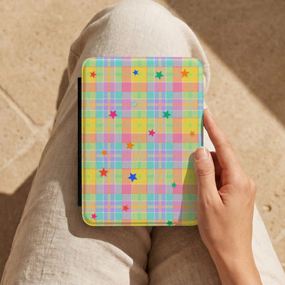 Pastel Plaid Stars Kindle case held on the lap while reading