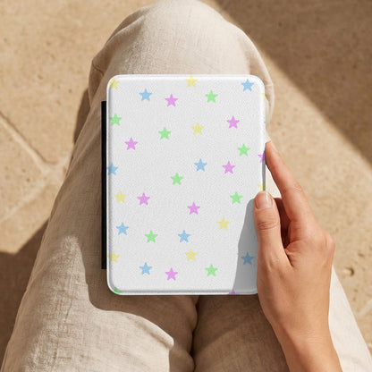 Pastel Stars Kindle case held on a lap while reading