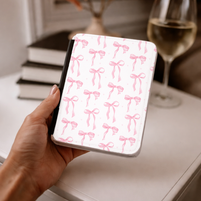 Watercolour pink bows repeating across a white Kindle cover