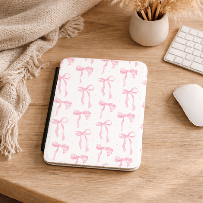 White Kindle case covered in a rosy pink bow print