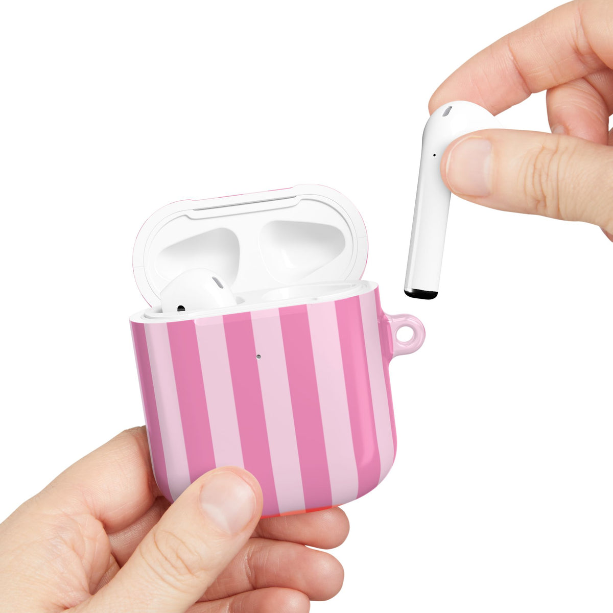 Pink Cabana Stripe AirPods case held in hand while taking out an AirPod