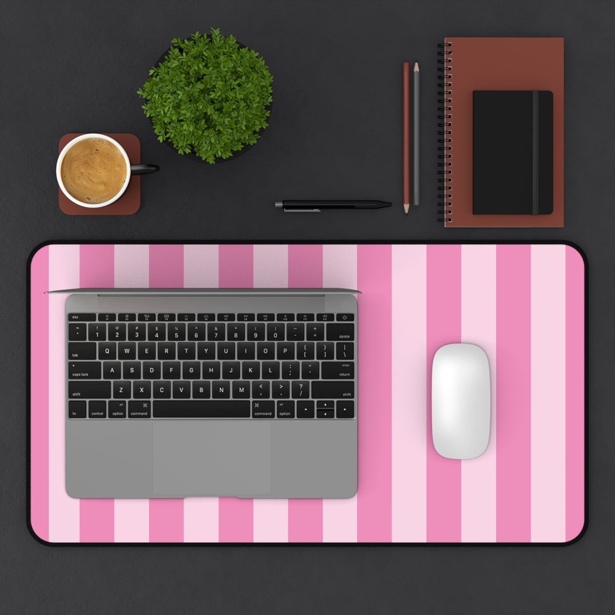 Pink cabana stripe desk mat in a wider size on a styled desk