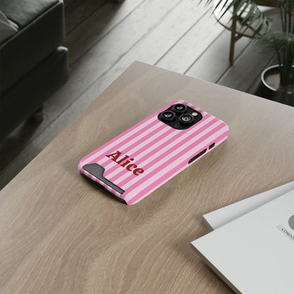 Pink Cabana Stripe card holder phone case on a wooden desk