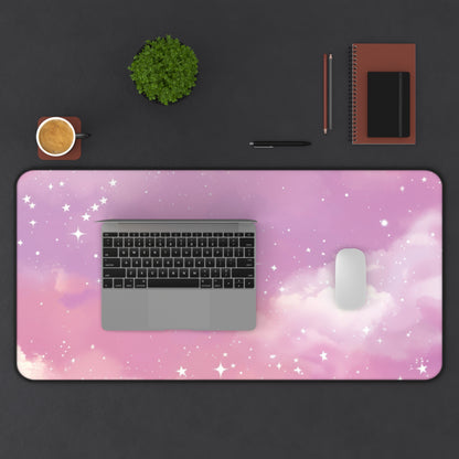 Pink Galaxy desk mat from above with a laptop and mouse on a dark desk