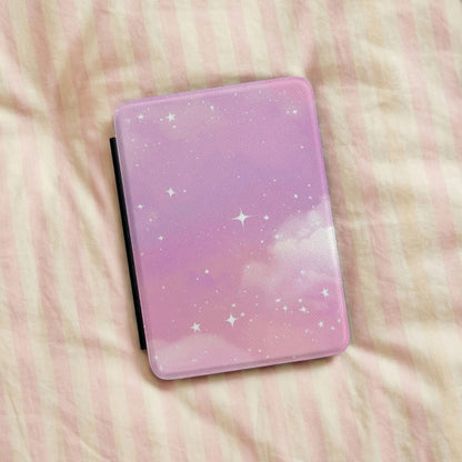 Pink Galaxy Kindle case on pink striped linen bedding