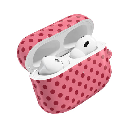 Pink polka dot AirPods case open with earbuds inside