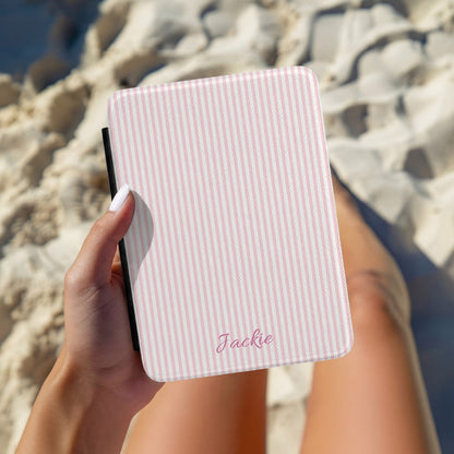 Pink Seersucker Kindle case held at the beach while reading