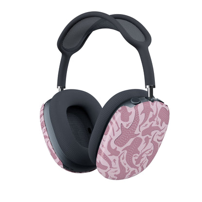 Whale shark pattern detail on an AirPods Max shell, white speckles across mauve-pink sharks