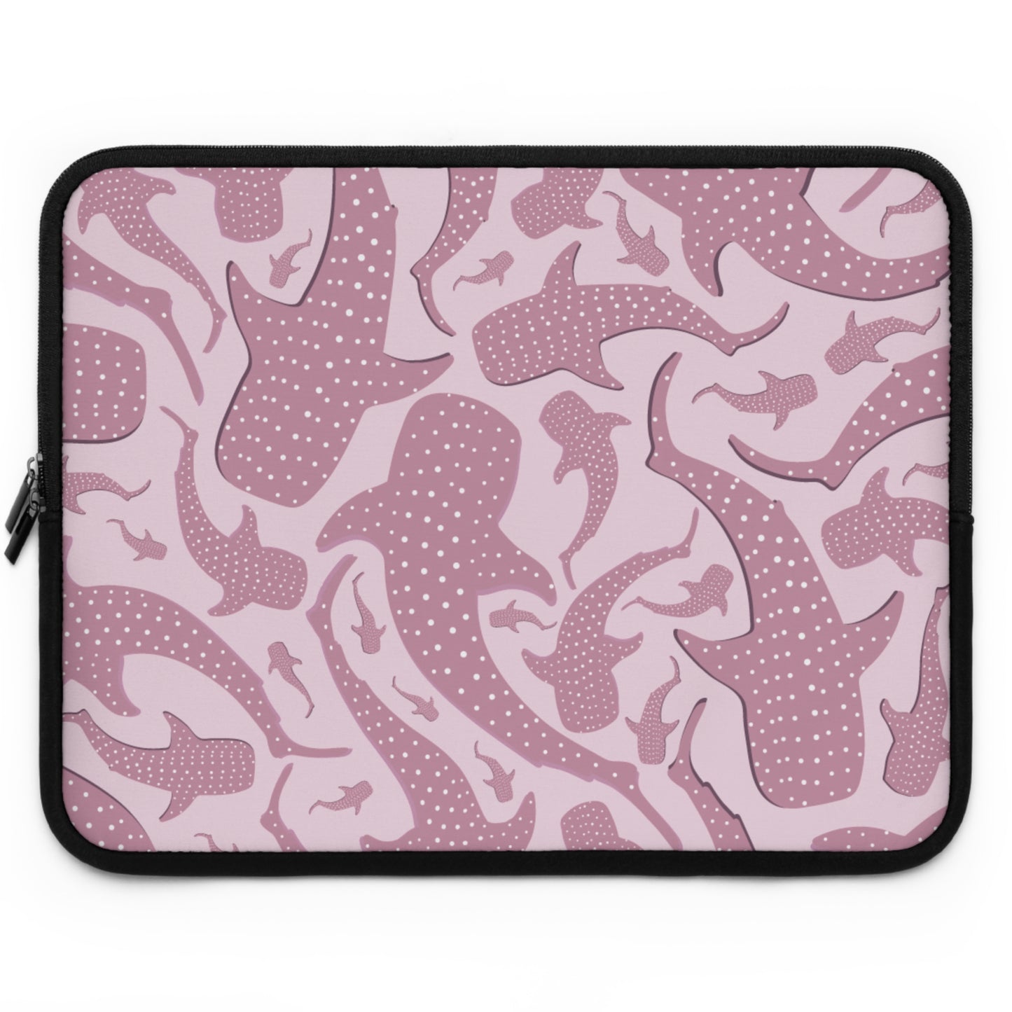 Matte neoprene surface of the pink whale shark laptop sleeve in blush with rose shark shapes