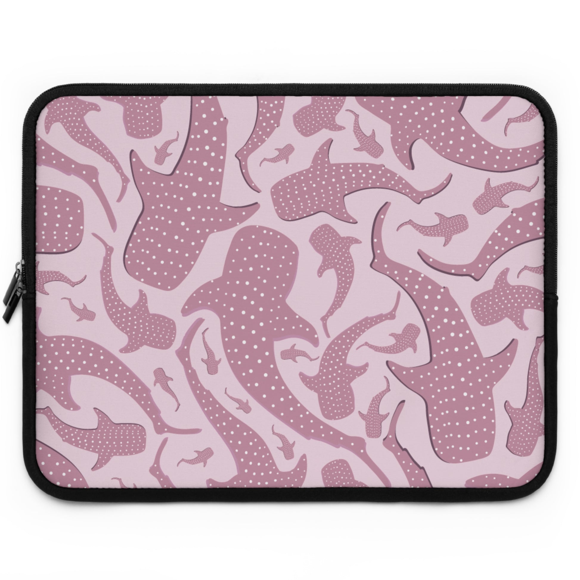 Matte neoprene surface of the pink whale shark laptop sleeve in blush with rose shark shapes
