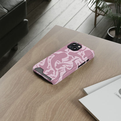 Pink Whale Shark phone case with card holder lying on a wooden desk