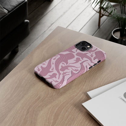 Pink Whale Shark phone case on a desk next to a notebook
