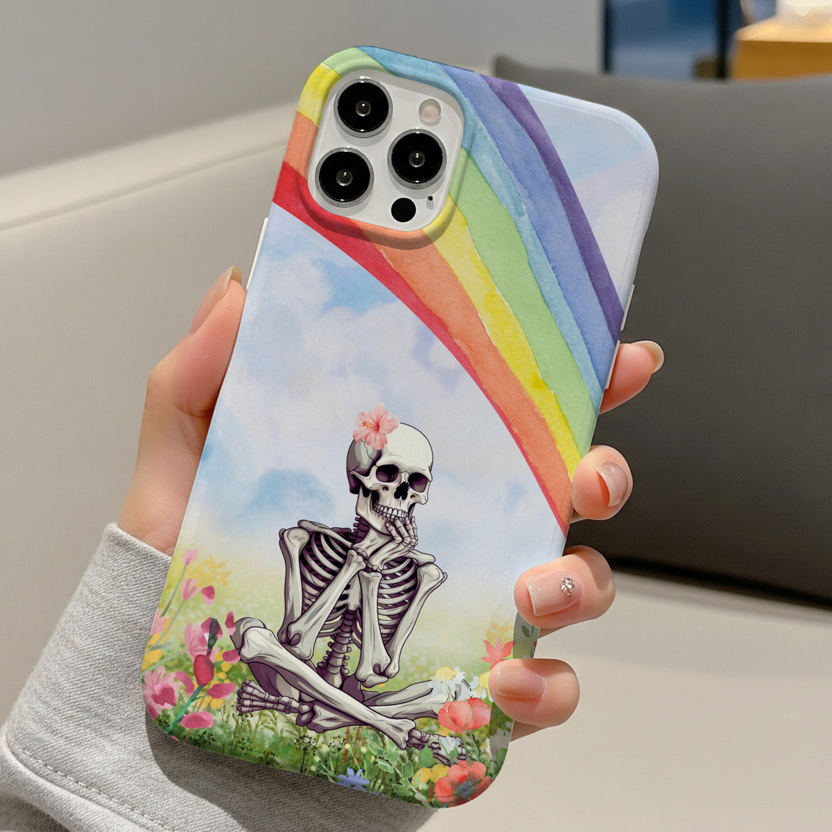 Rainbow Skeleton tough phone case held in hand
