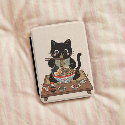 Ramen Cat Kindle case lying on pink striped bedding