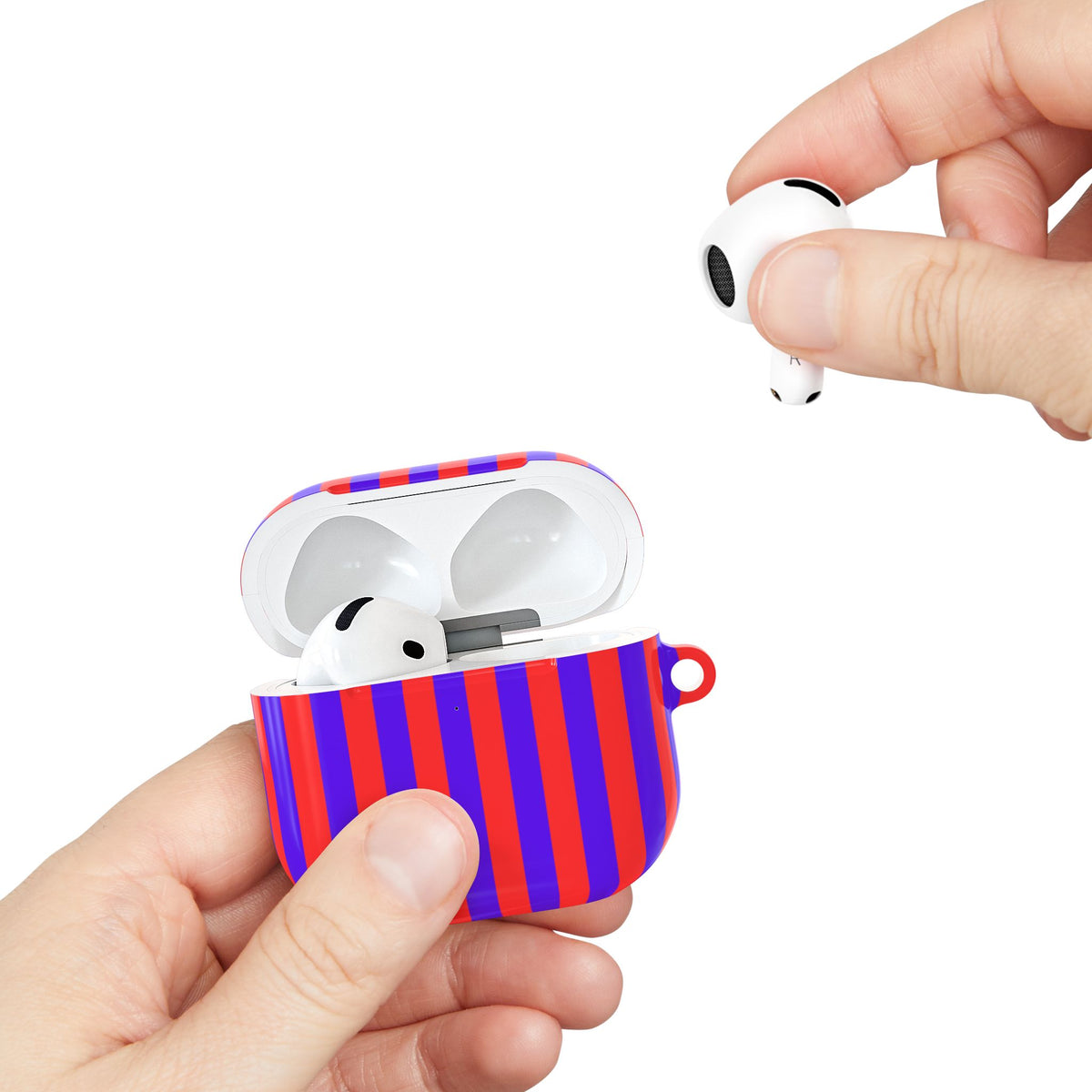 Red Cabana Stripe AirPods case held in hand while taking out an earbud