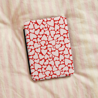 Red hearts Kindle case on striped bed linen