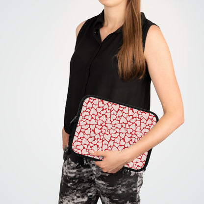 Woman carrying a red hearts laptop sleeve