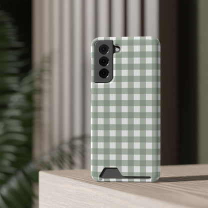Sage Gingham card holder phone case standing on a table
