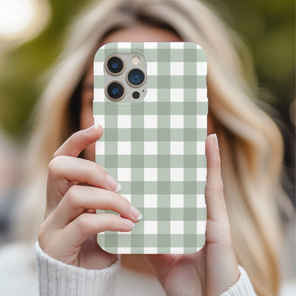 Sage Gingham tough phone case held up in front of a face