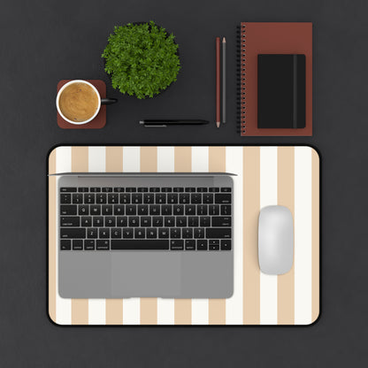 Sand cabana stripe desk mat on a dark desk with a laptop and mouse