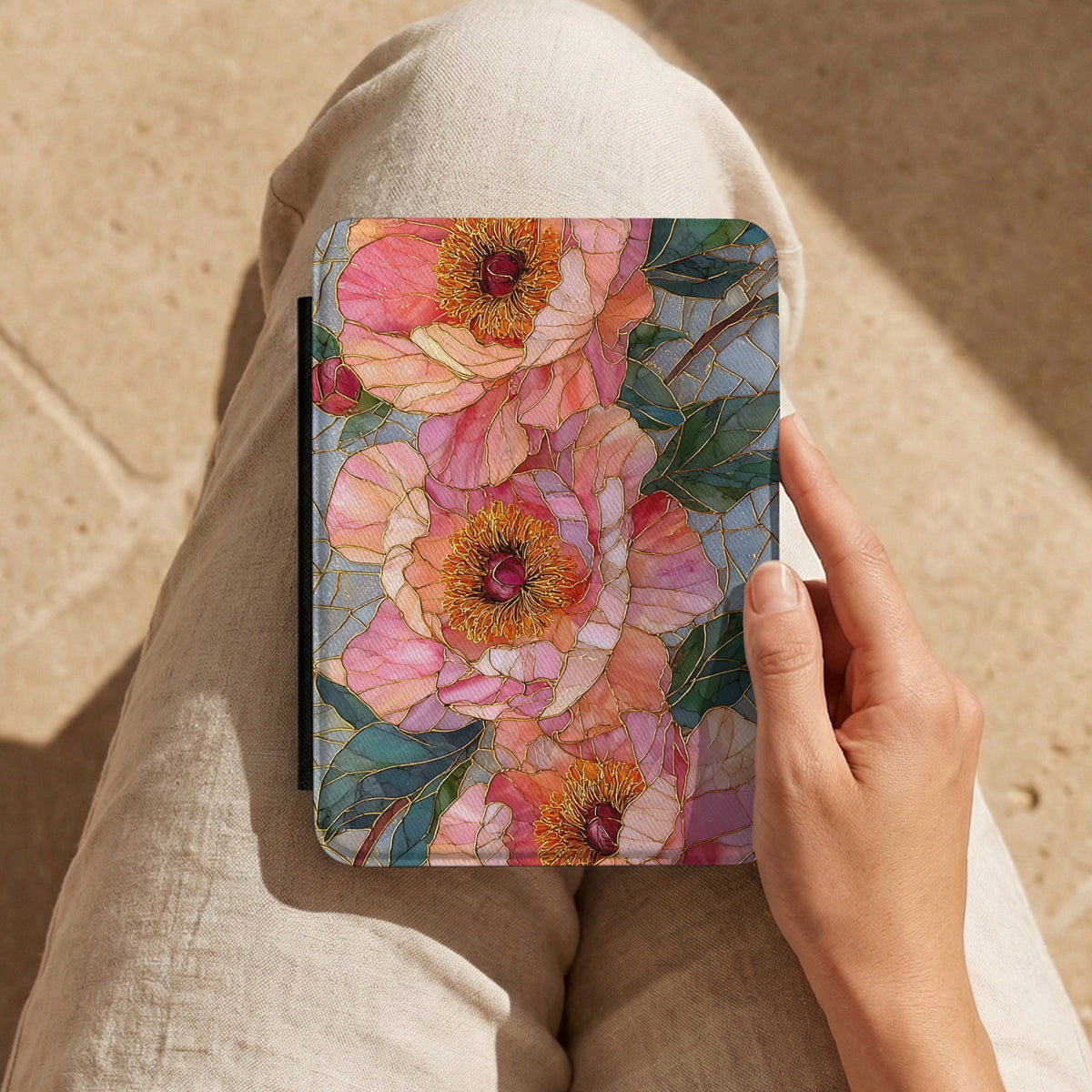 Stained Glass Peony Kindle case held on the lap while reading