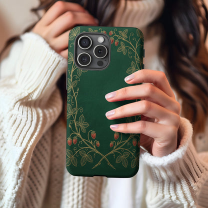 Strawberry Vine tough phone case held in hand with cream sweater