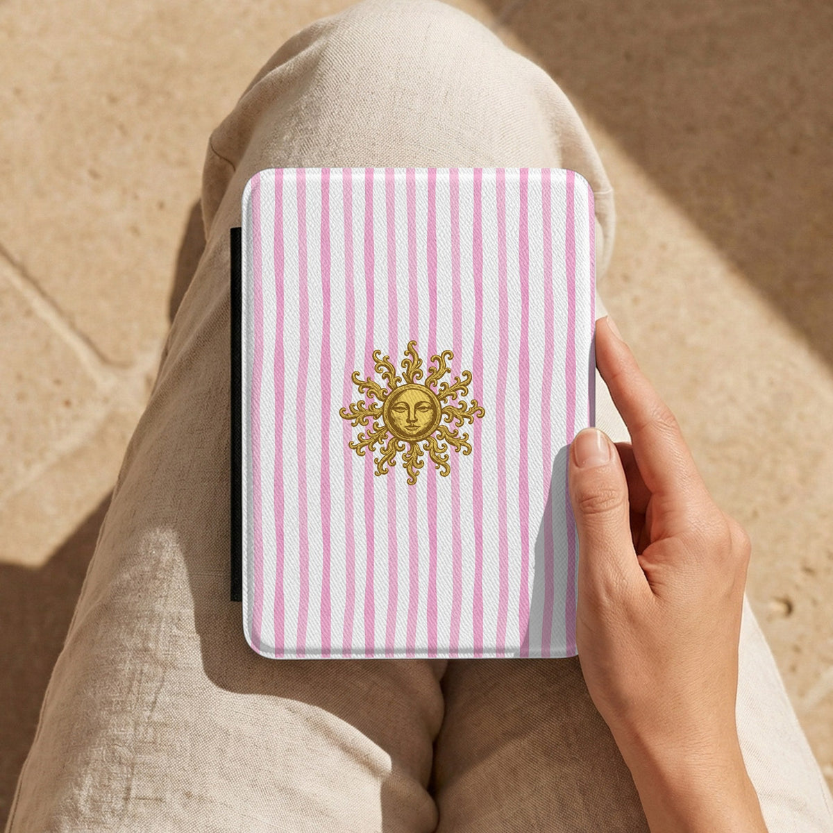 Sunny Striped Pink Kindle case held on the lap while reading