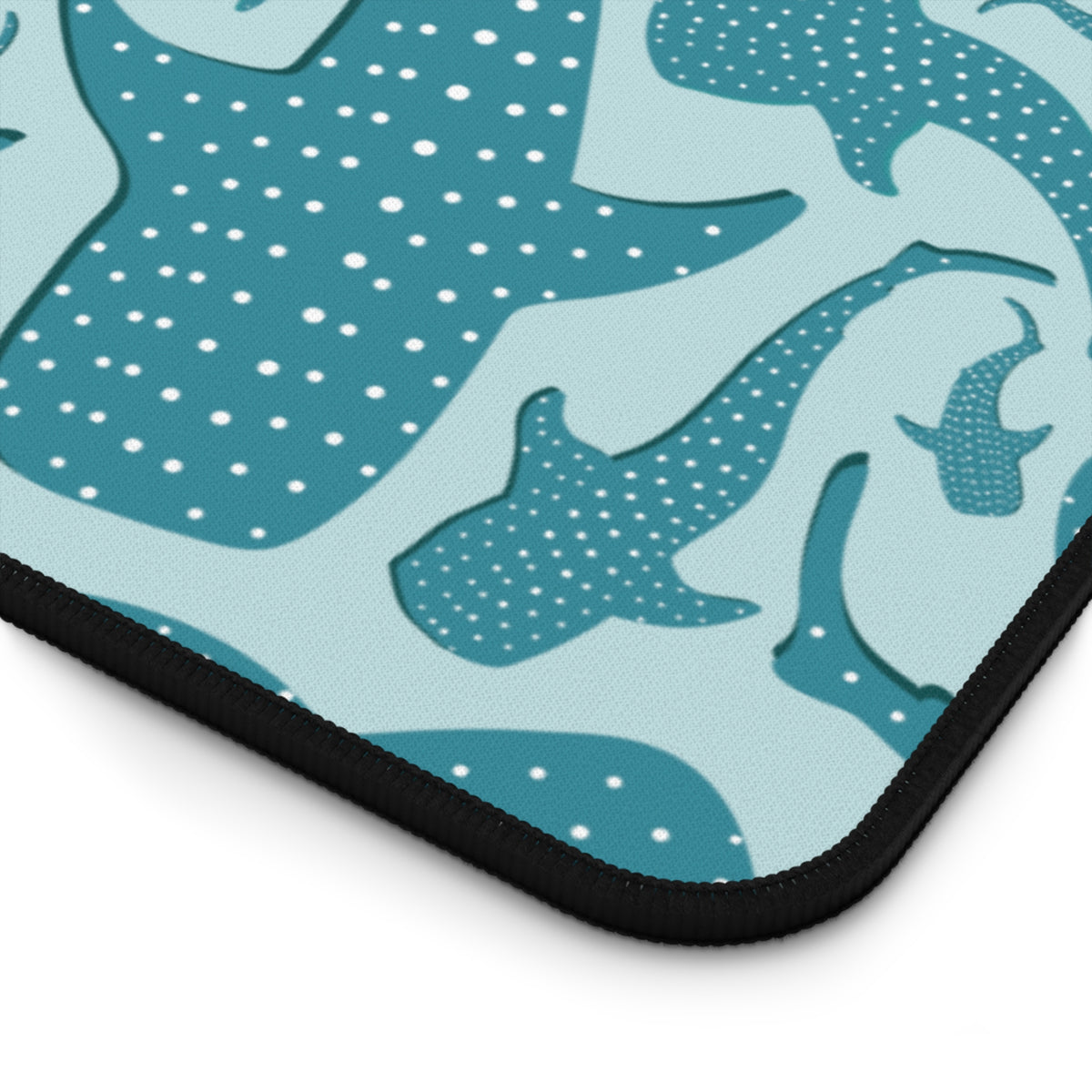 Close-up of the Teal Whale Shark desk mat stitched edge