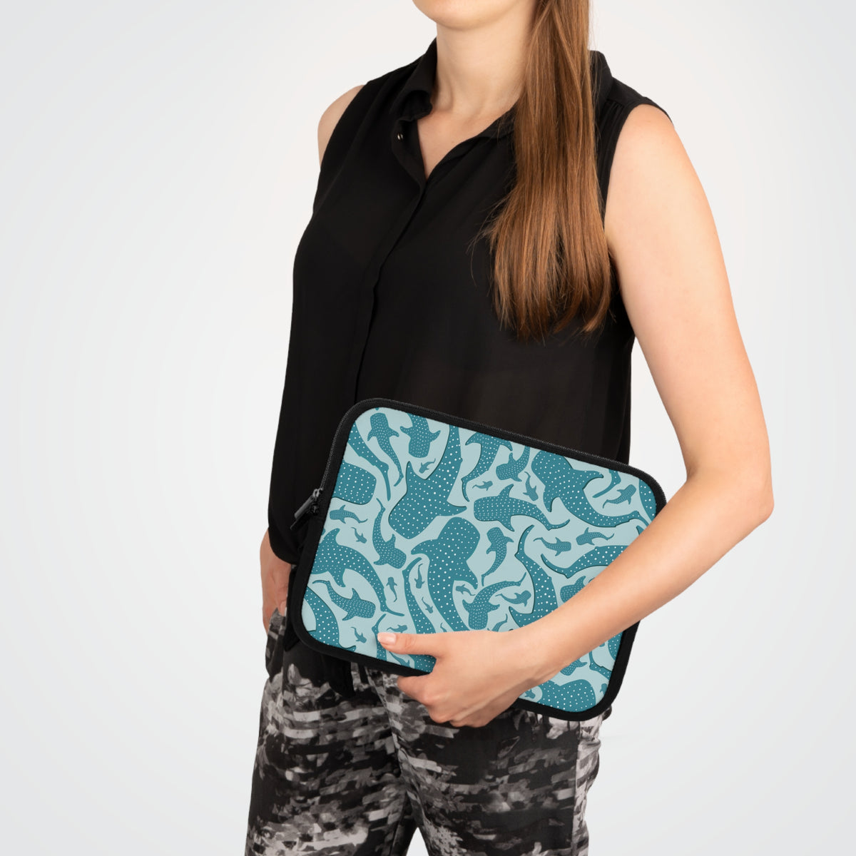 Teal Whale Shark laptop sleeve carried under the arm