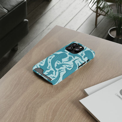 Teal Whale Shark phone case with card holder lying on a wooden desk