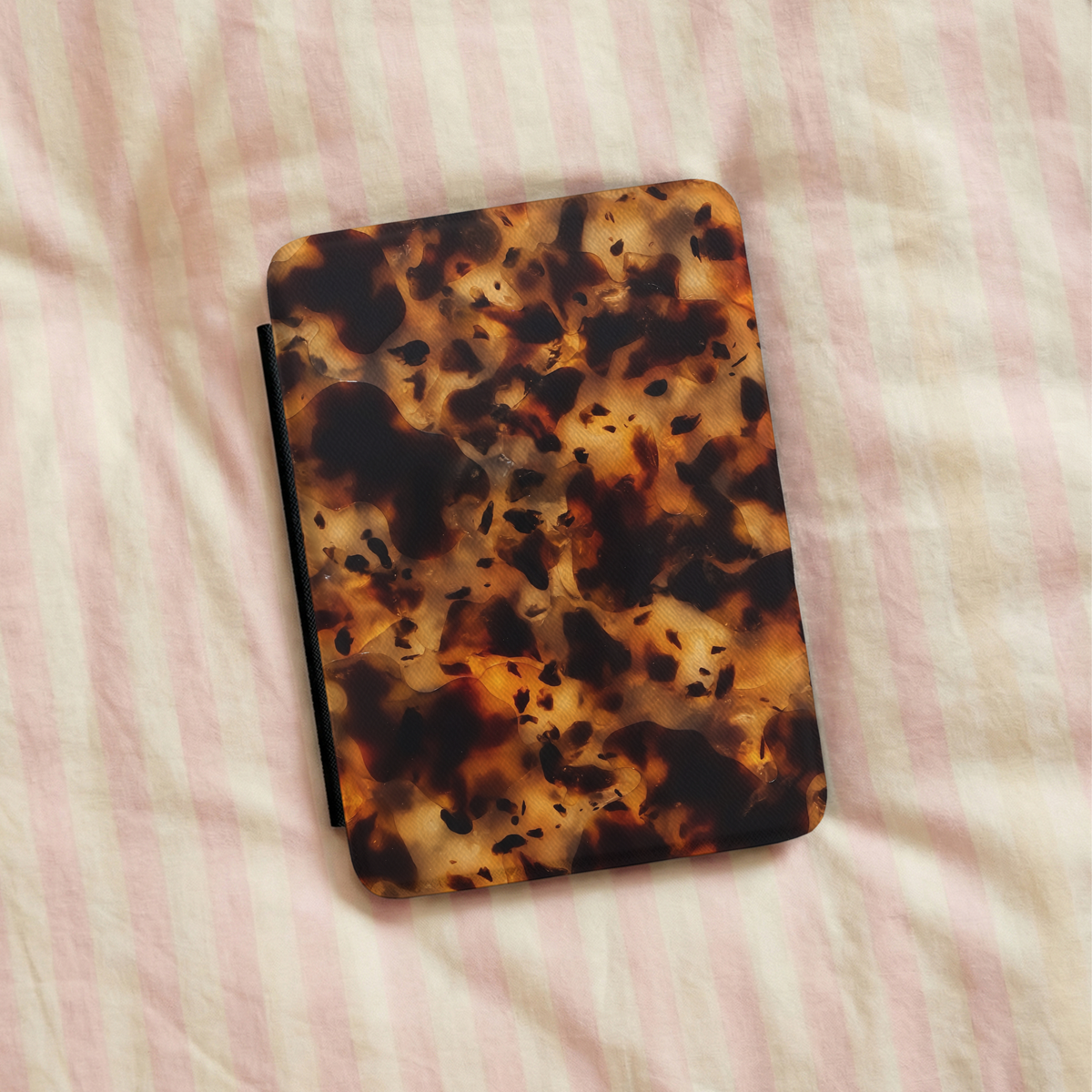 Tortoiseshell Kindle case in a cozy reading scene