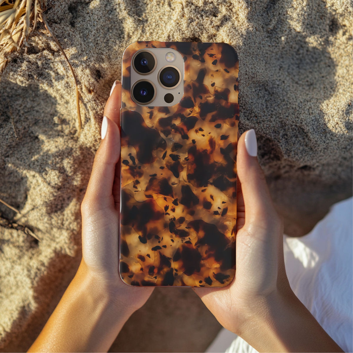 Tortoiseshell phone case lifestyle photo, warm amber tones