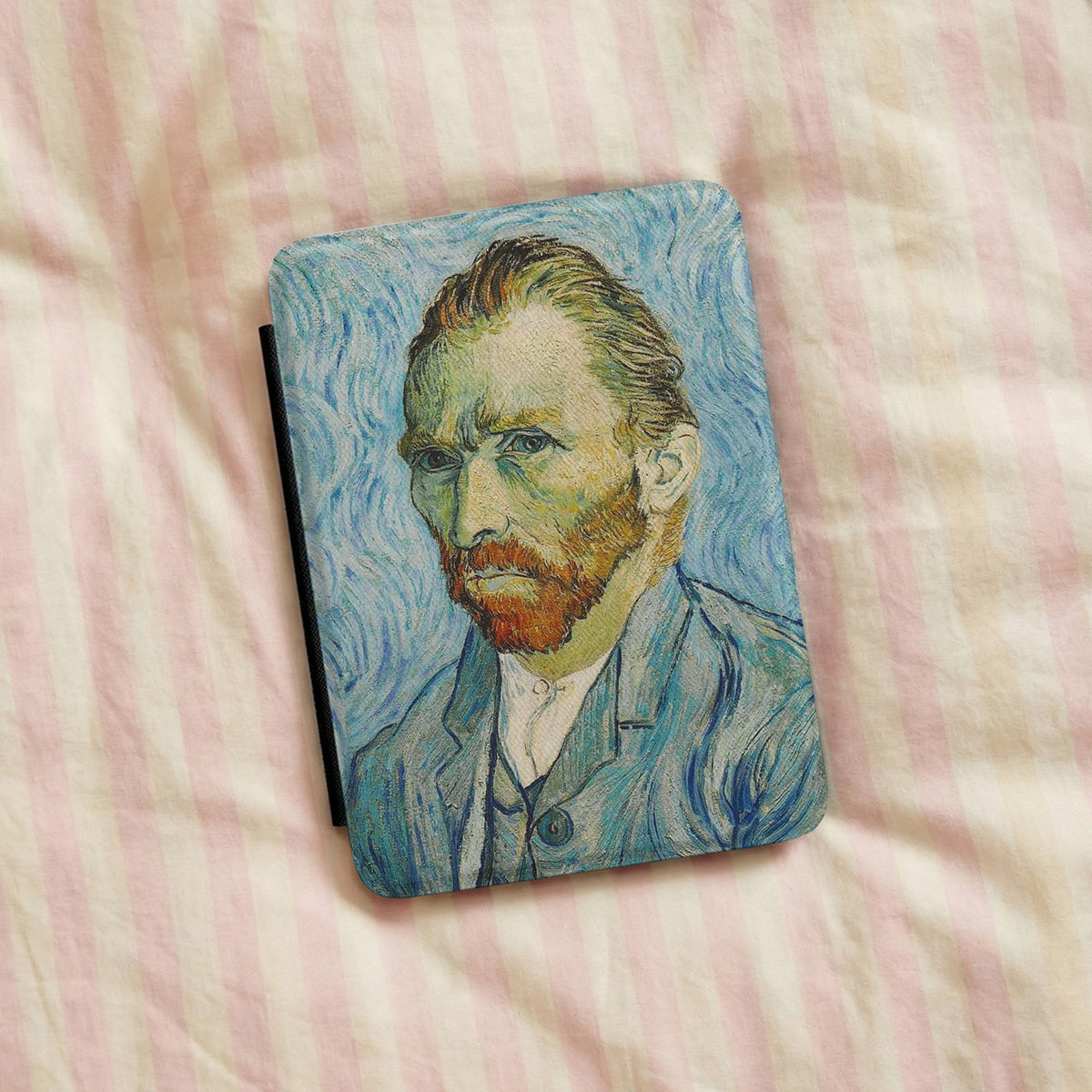 Van Gogh Portrait Kindle case on pink striped linen bedding