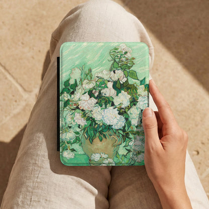 Van Gogh Roses Kindle case held on a lap while reading