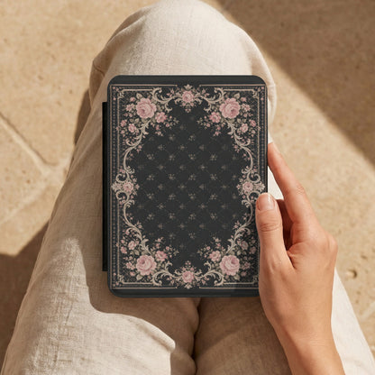 Victorian Rose Kindle case held on a lap while reading outdoors