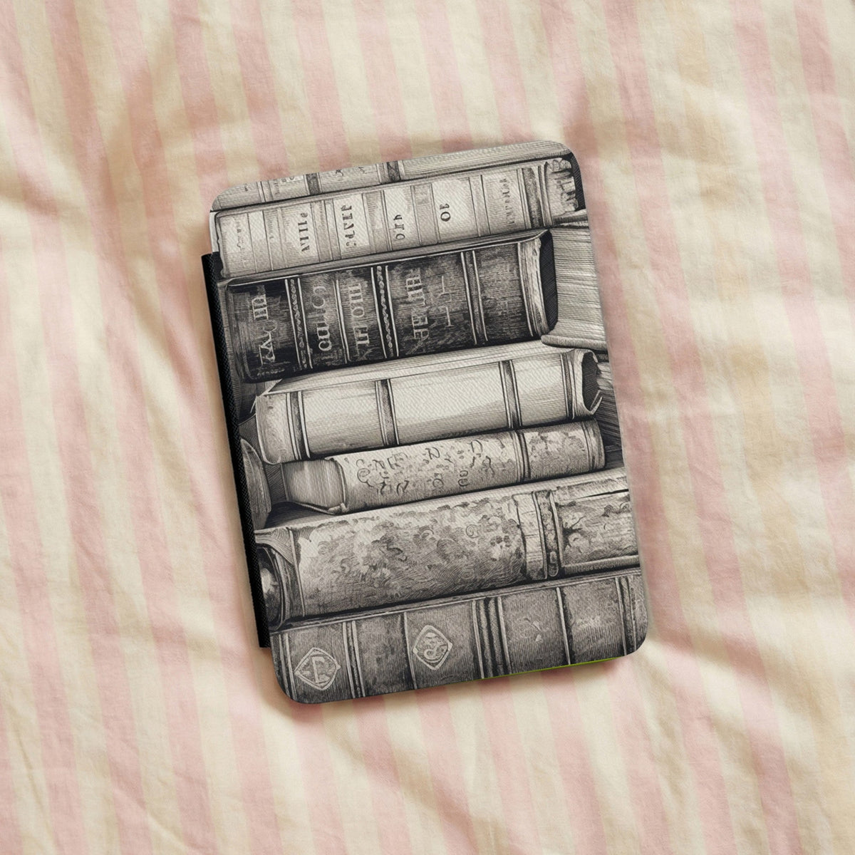 Vintage Books Kindle case on striped bedding