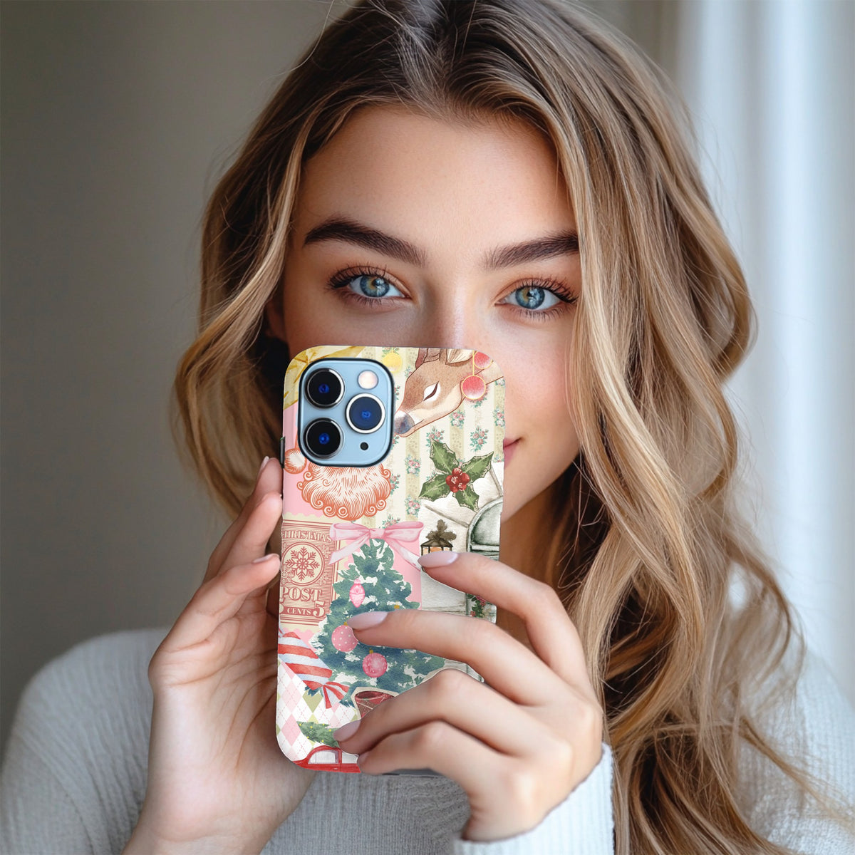 Vintage Christmas tough phone case held up next to the face
